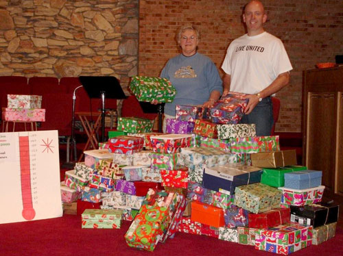 Judy Fortner, Pastor Greg Voight, and all the shoeboxes