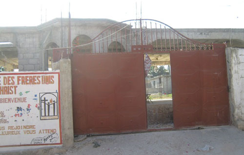 A church in the Delmas rea. Part of this gate wall was destroyed. A large number of Haitians came here for refuge.