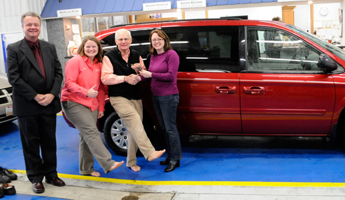 L-r: Pete Schownir, HU director of gift planning; Mindi Ahl, 2007 alum and business manager at Tom Ahl Chrysler, Dodge, Jeep in Lima, Ohio; Tom Ahl, owner of Tom Ahl dealership; and Grace McBrayer, director of volunteer service and outreach ministry. (With their "knock your socks off" deal)