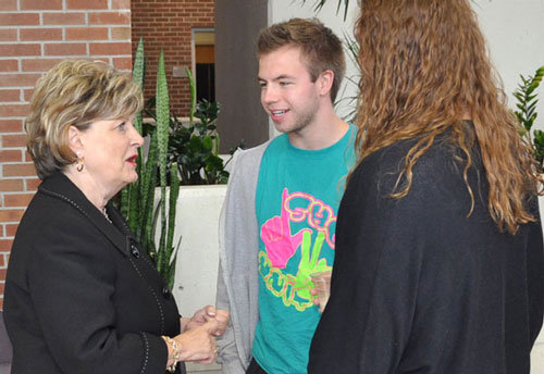 Dr. Sherilyn Emberton with Huntington University students at a reception on April 26.