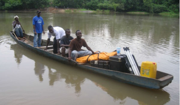 Transporting the Jesus film equipment by canoe.
