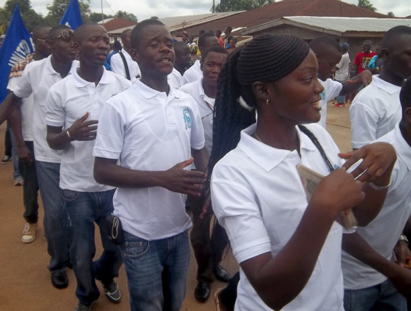 A parade, with the various district youth groups represented, is part of the annual youth camp in Sierra Leone.