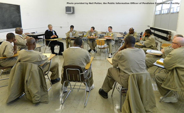 Dr. Jack Heller leading a discussion of Shakespeare with inmates at Pendleton prison.