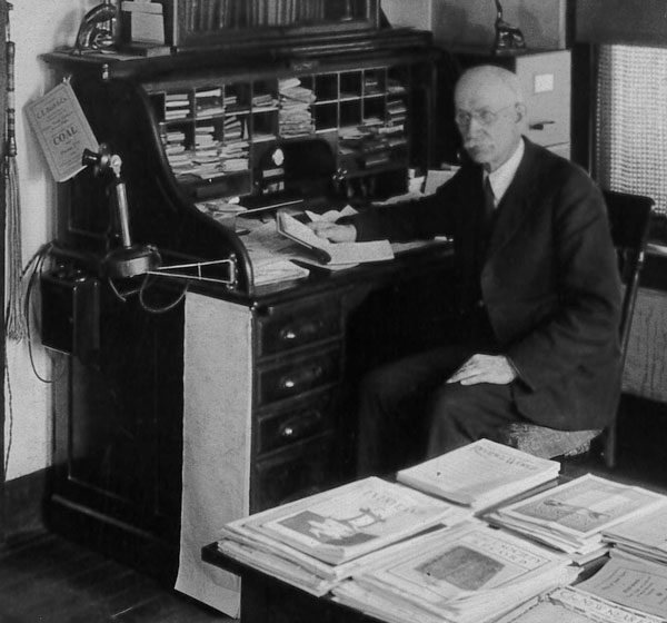 Jacob Howe at his desk in the missions office in Huntington, Ind.